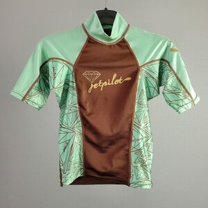 JET PILOT // rashie rash guard short sleeved mock neck mint & brown grap…